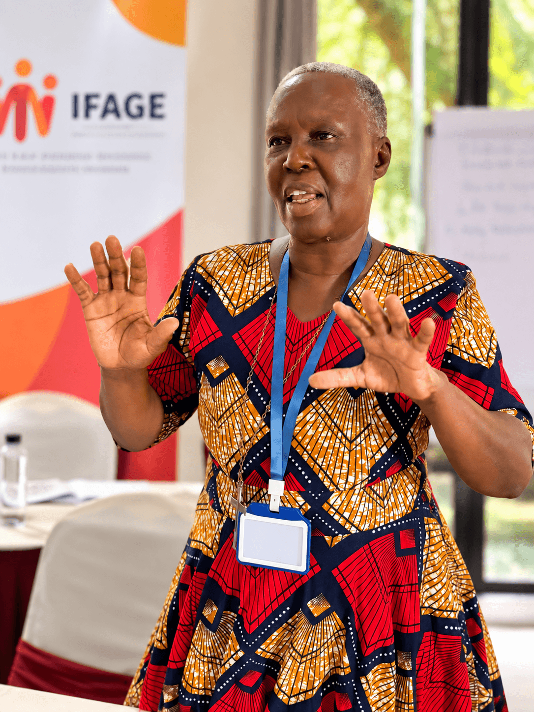 Women and community members in conversation at an IFAGE dialogue